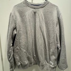 Herschel supply crew neck sweater unisex medium with a small pink stain by label